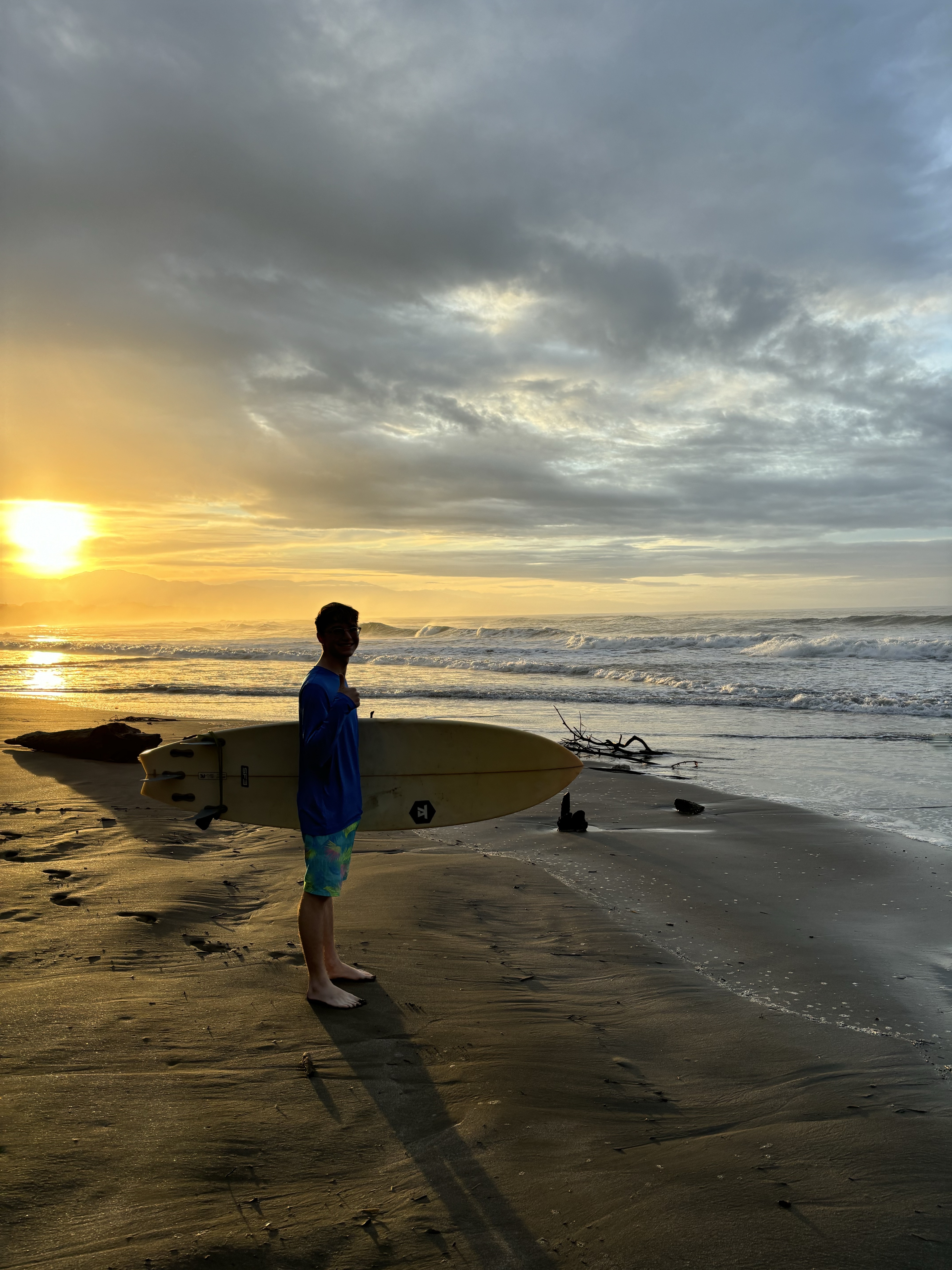 Surfer silhouetted against a beautiful NJ sunset